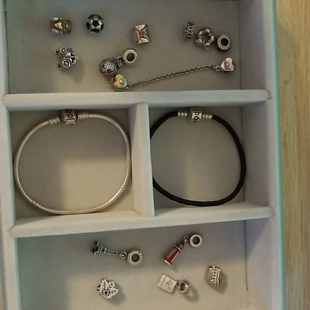 Two Pandora bracelets with fourteen charms